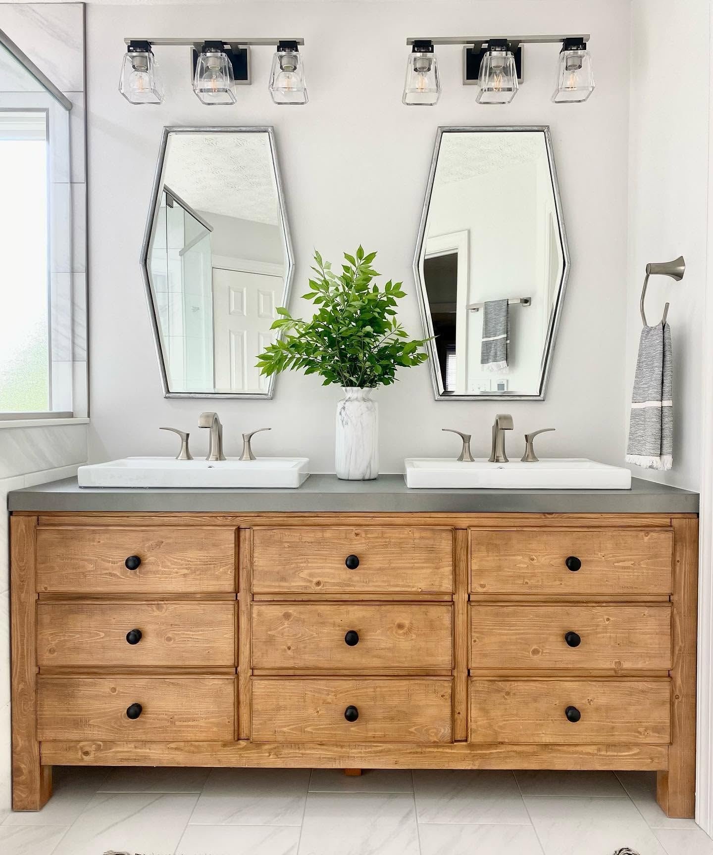 Wood double vanity with concrete top and elongated hexagon mirrors